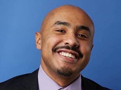 Headshot of Altaf smiling