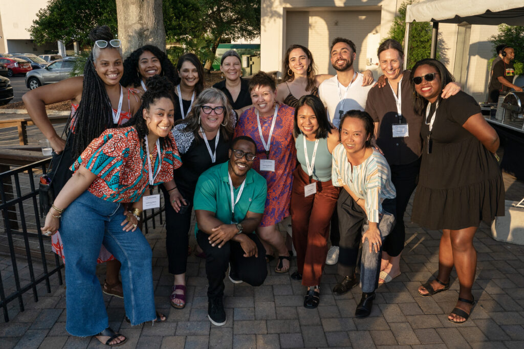 NFG staff poses for a team photo on the outside terrance of the Hotel Ballast.