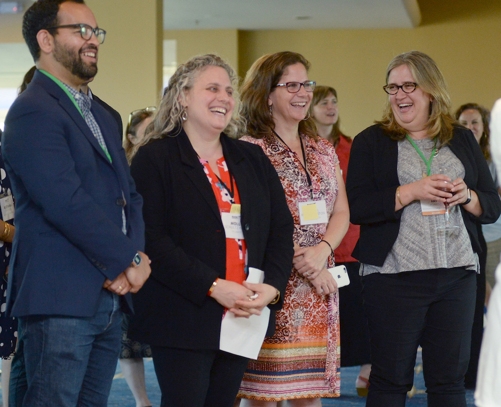 Photo of Amy, Dennis Quirin, and Laine Romero-Alston celebrating Molly Schultz Hafid award of the NFG Award for Excellence at the 2018 National Convening in St. Louis, MO